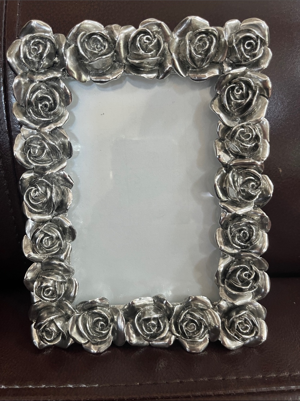 Rose adorned 6 1/2 x 4 1/2 metal frame
